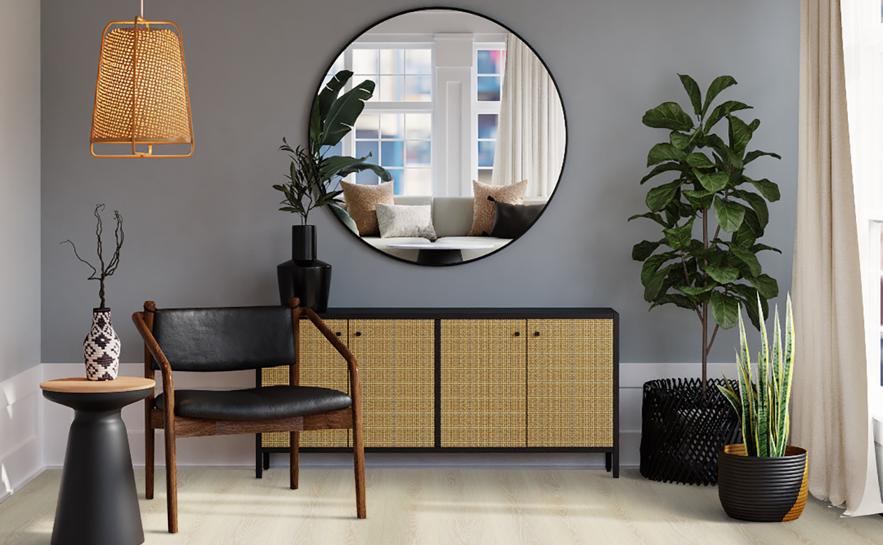 hardwood flooring in entryway with chair and natural decor.